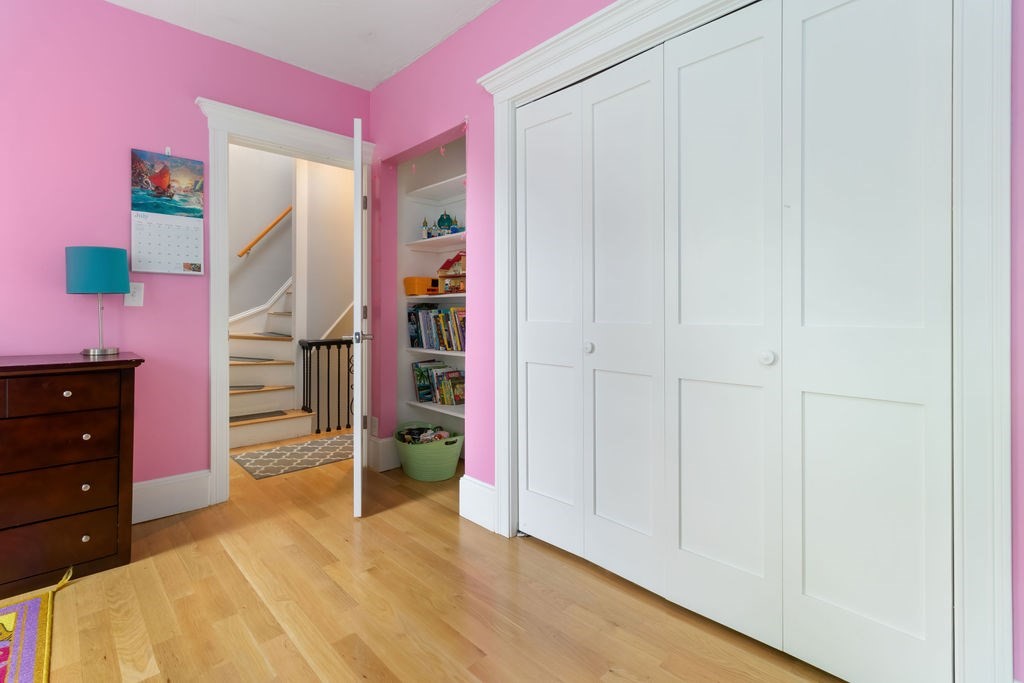 4 Goodwin Court Boston, MA 02127 - Photo 15 of 27 wooden floor and closet in a bedroom