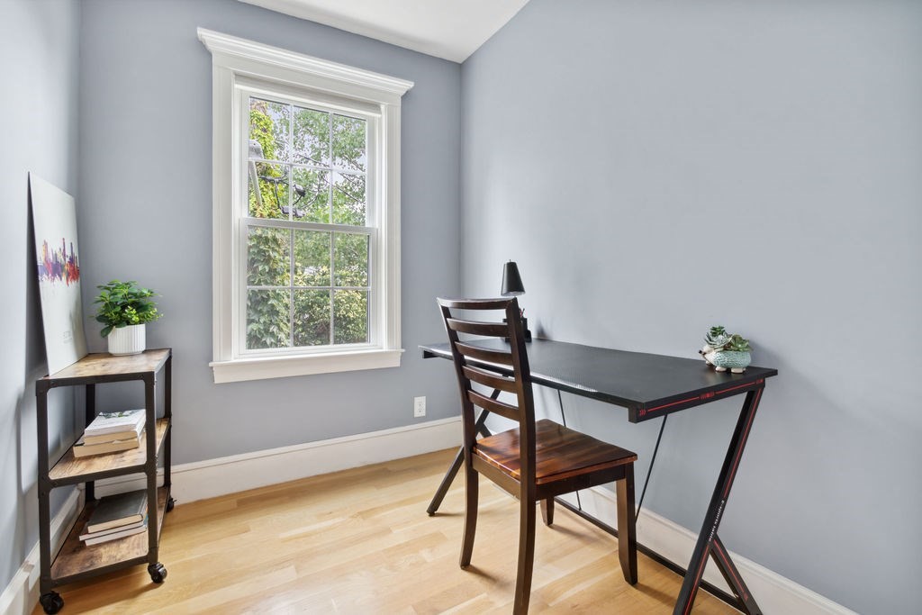 4 Goodwin Court Boston, MA 02127 - Photo 16 of 27 a view of a workspace with furniture and a window