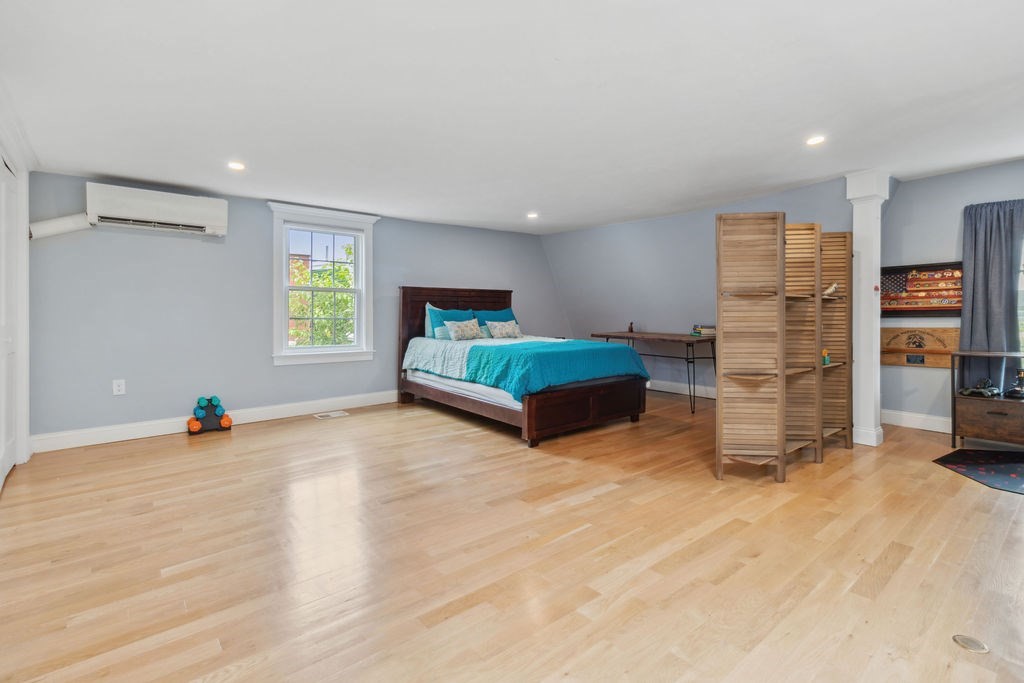 4 Goodwin Court Boston, MA 02127 - Photo 18 of 27 a living room with closet and a window