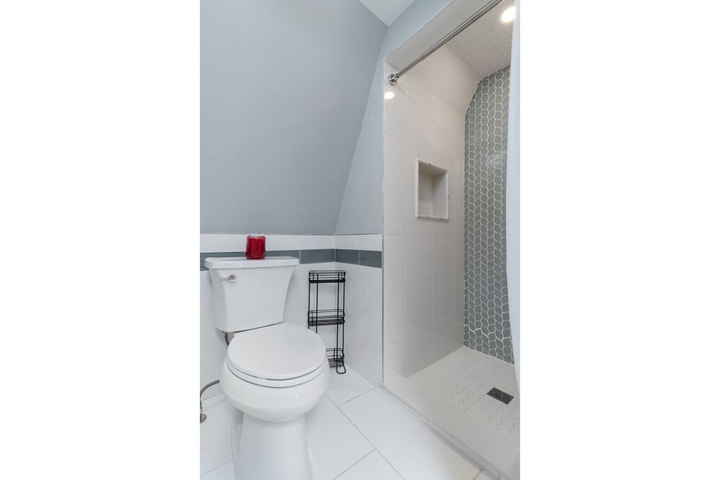 4 Goodwin Court Boston, MA 02127 - Photo 20 of 27 a bathroom with a toilet and a shower