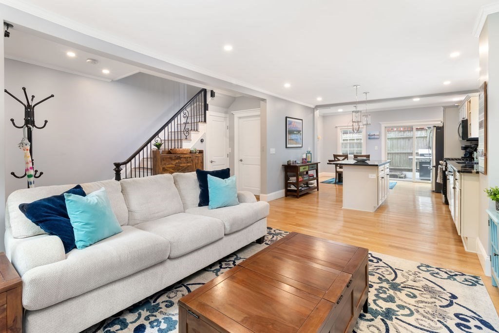 4 Goodwin Court Boston, MA 02127 - Photo 2 of 27 a living room with furniture and wooden floor