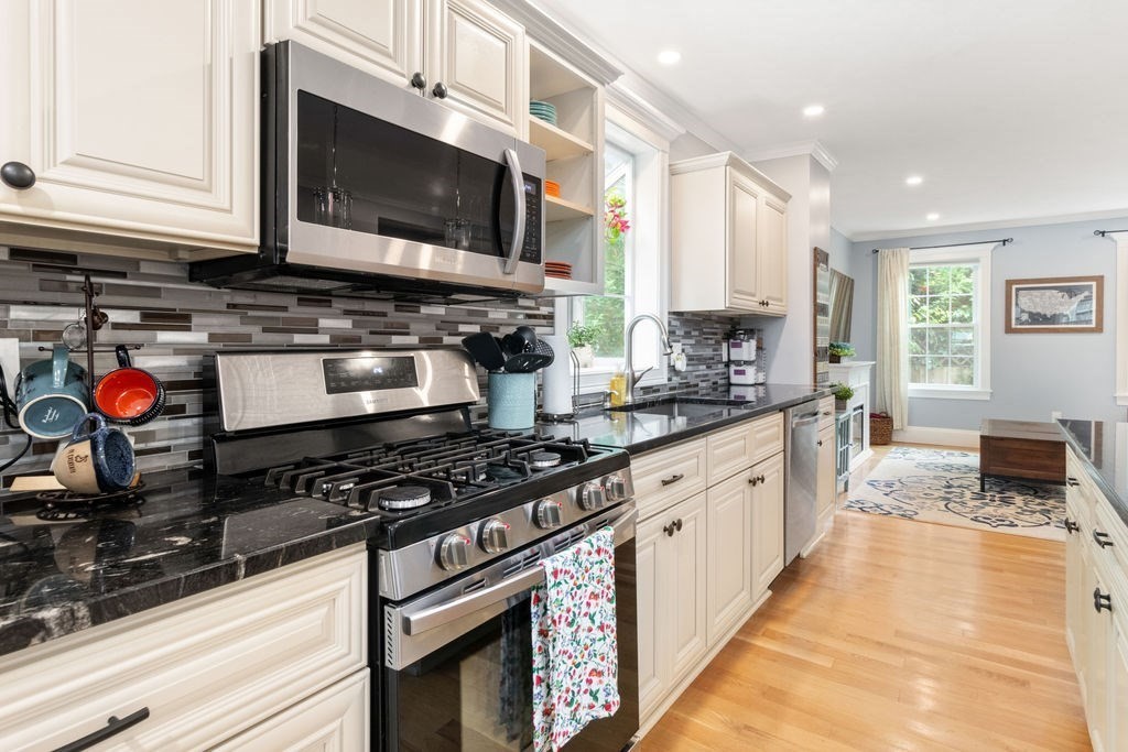 4 Goodwin Court Boston, MA 02127 - Photo 5 of 27 a kitchen with stainless steel appliances granite countertop a stove and a microwave