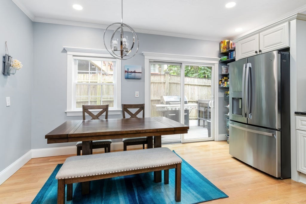 4 Goodwin Court Boston, MA 02127 - Photo 8 of 27 a room with stainless steel appliances furniture dining table and wooden floor