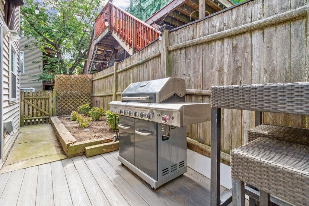 4 Goodwin Court Boston, MA 02127 - Photo 10 of 27 a view of a deck with wooden floor and outdoor seating
