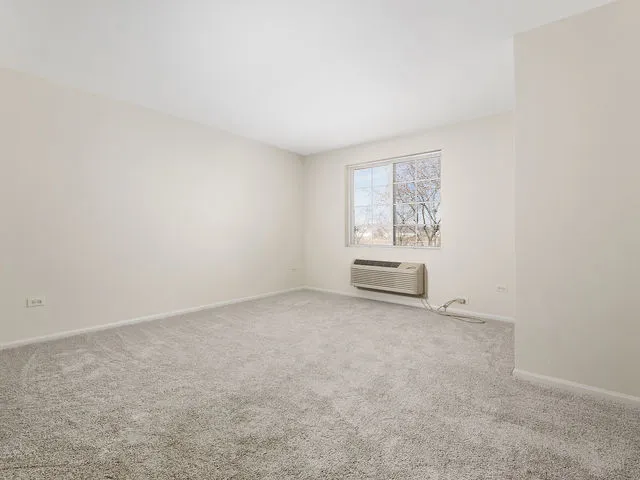 an empty room with closet area
