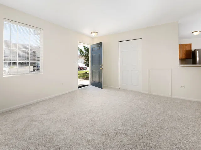 a view of an empty room with a window