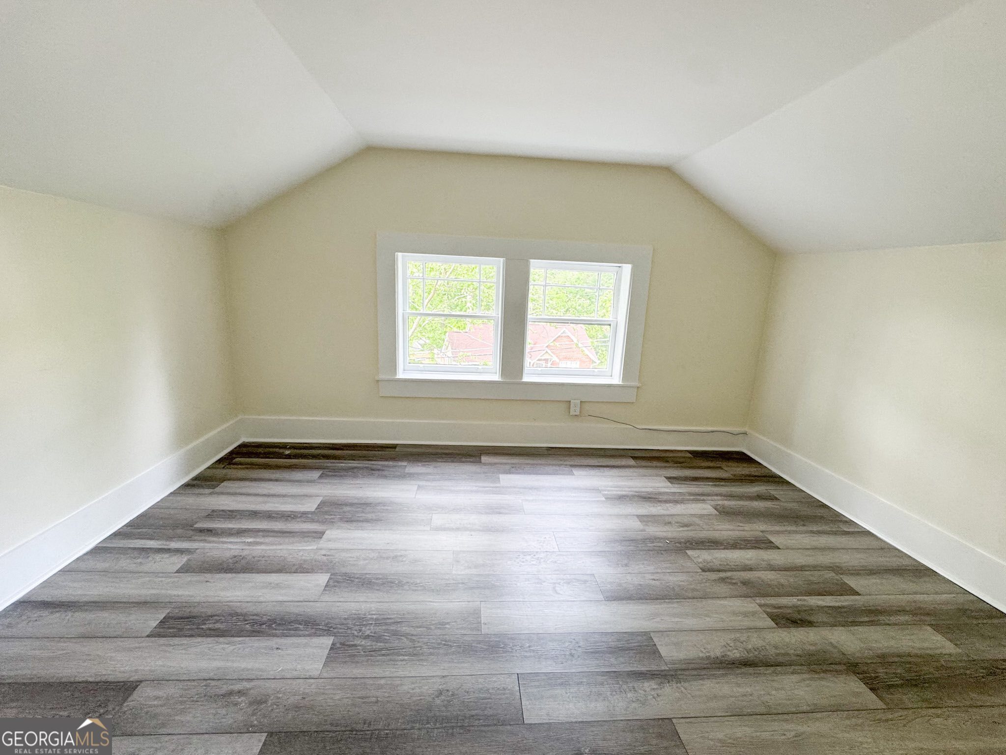 1 Vassar Drive Southeast Rome, GA 30161 - Photo 11 of 12 an empty room with wooden floor and windows