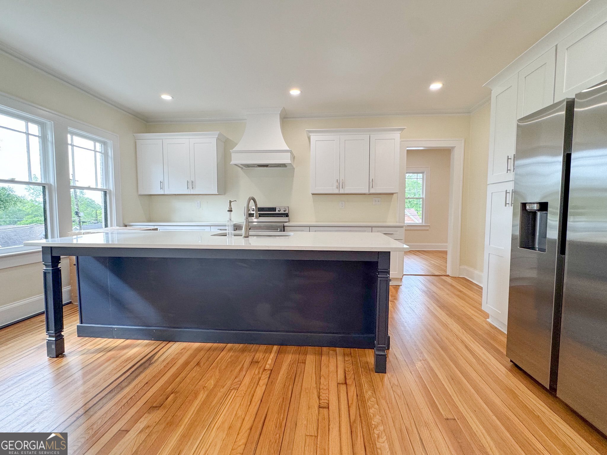 1 Vassar Drive Southeast Rome, GA 30161 - Photo 2 of 12 a kitchen with kitchen island granite countertop a sink cabinets and stainless steel appliances