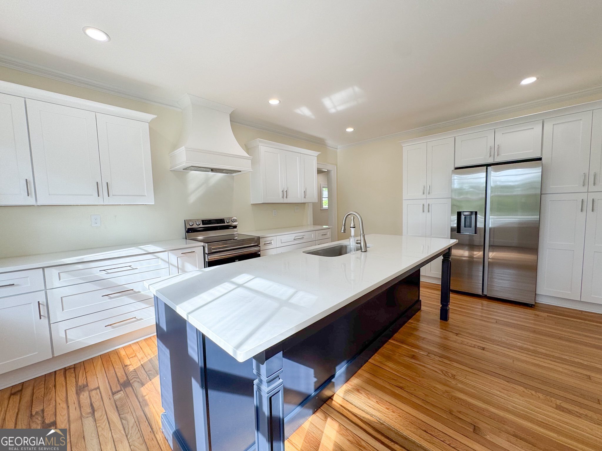 1 Vassar Drive Southeast Rome, GA 30161 - Photo 3 of 12 a kitchen with kitchen island granite countertop a sink a counter space and stainless steel appliances