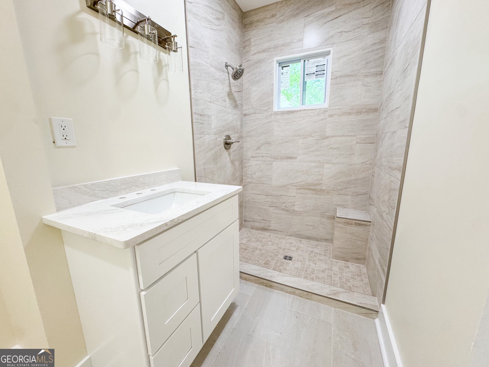 1 Vassar Drive Southeast Rome, GA 30161 - Photo 8 of 12 a bathroom with a granite countertop sink a shower and a mirror