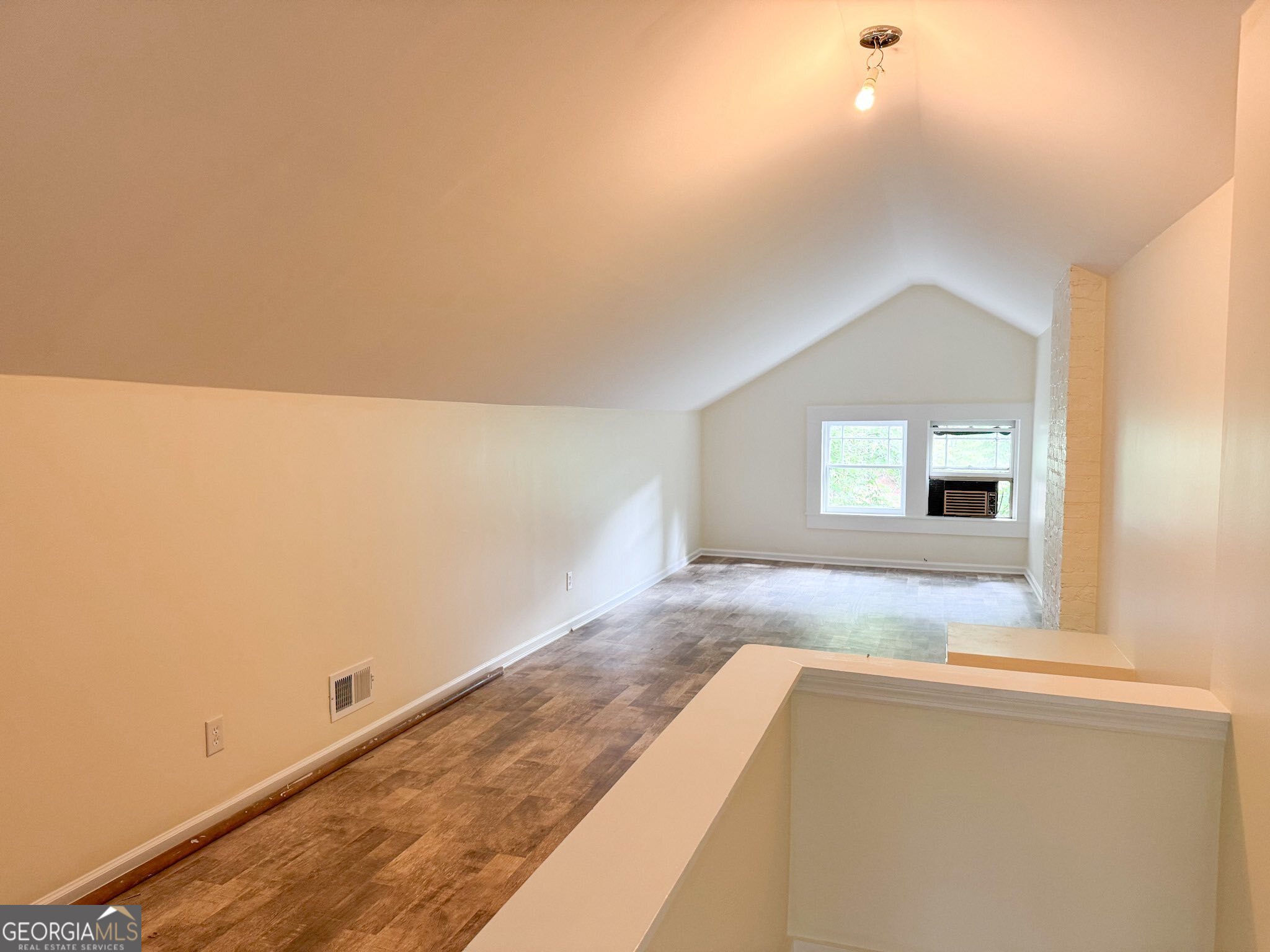1 Vassar Drive Southeast Rome, GA 30161 - Photo 10 of 12 an empty room with wooden floor and windows