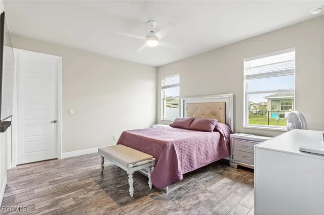 a bedroom with a bed and a table