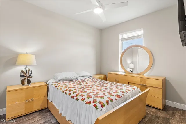 a bedroom with a bed and a lamp