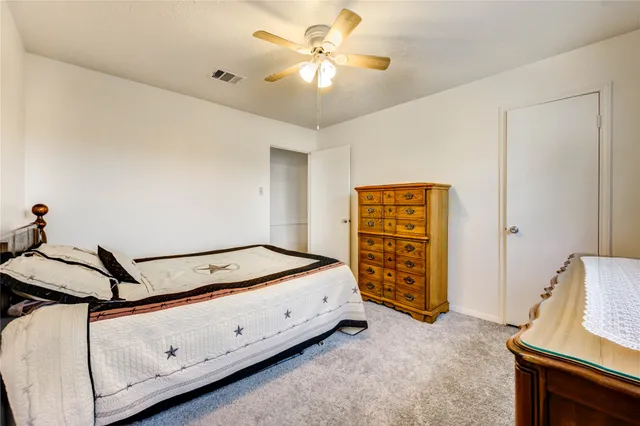 a room with bed and window