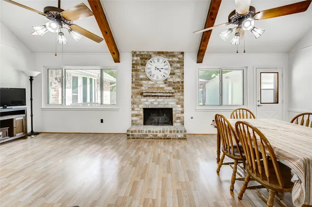 a view of a livingroom with furniture chandelier front door and furniture