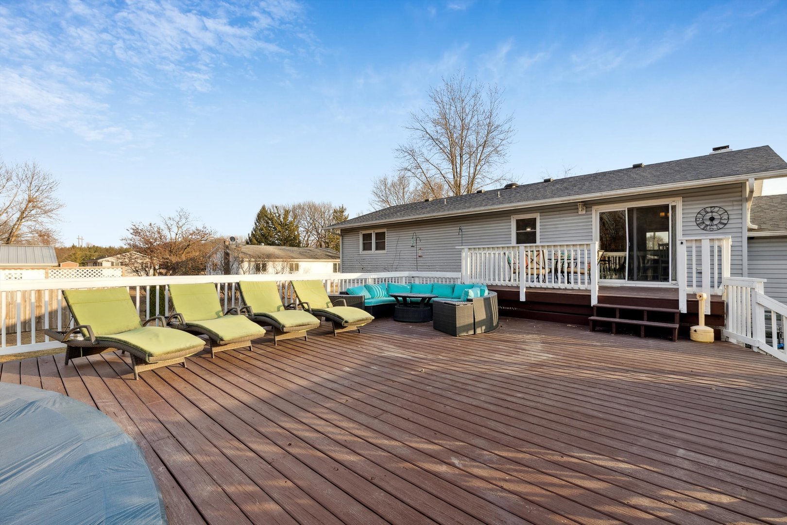 5430 Holly Road Fulton, IL 61252 - Photo 12 of 33 a view of a roof deck with table and chairs a barbeque with wooden floor and fence