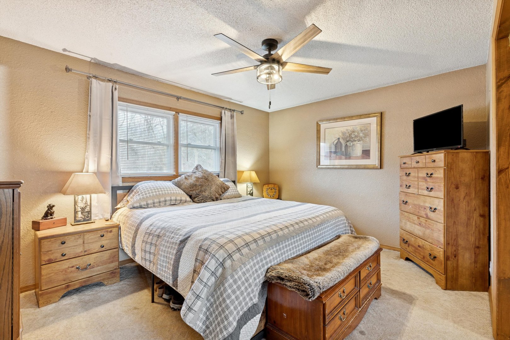 5430 Holly Road Fulton, IL 61252 - Photo 14 of 33 a bedroom with a bed and a flat screen tv