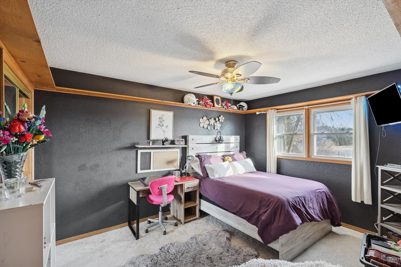 5430 Holly Road Fulton, IL 61252 - Photo 17 of 33 a bedroom with a bed and a chandelier