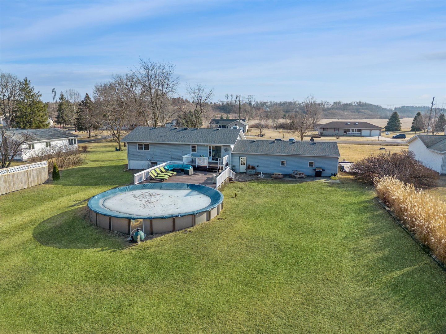 5430 Holly Road Fulton, IL 61252 - Photo 2 of 33 a view of a swimming pool with a table and chairs