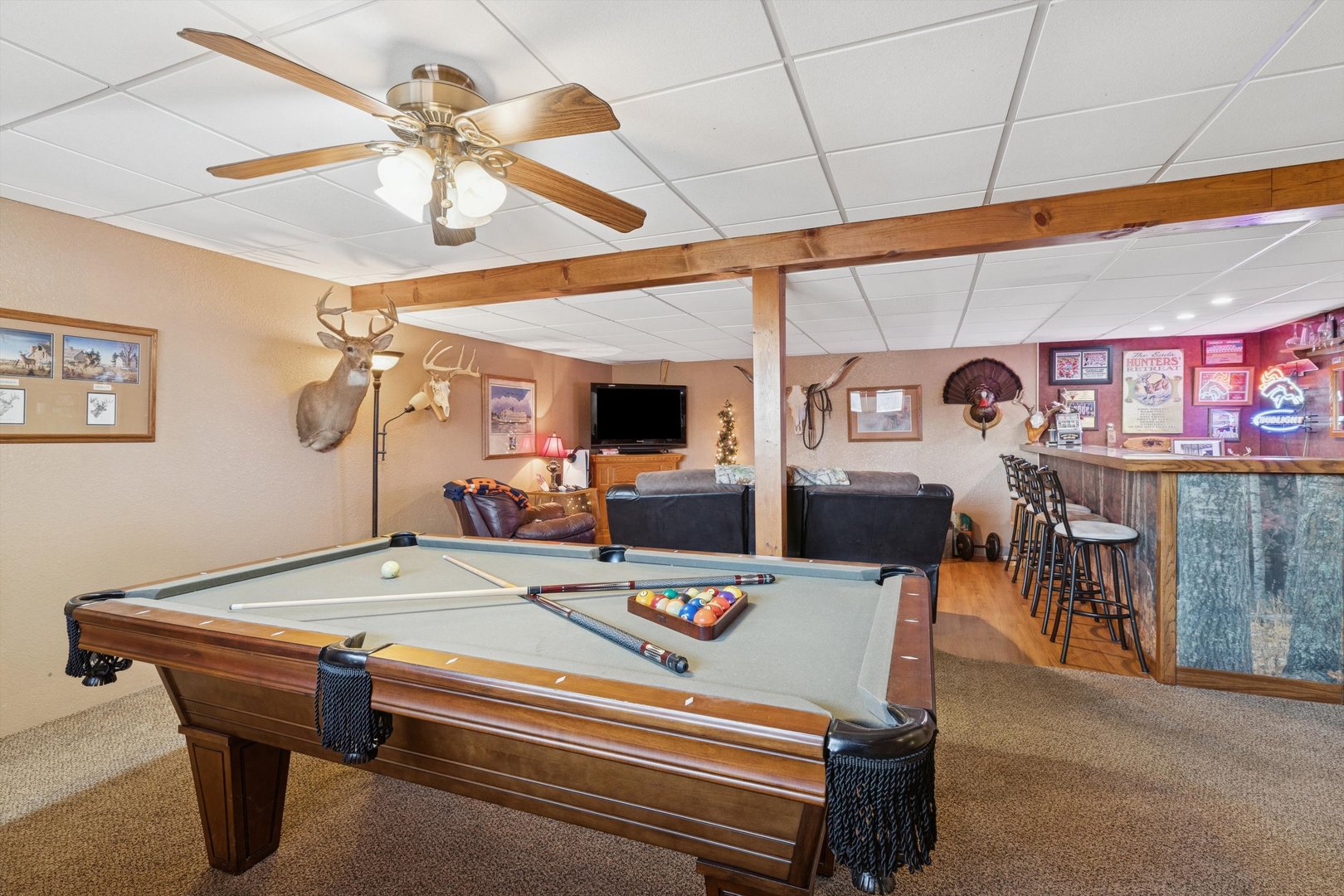 5430 Holly Road Fulton, IL 61252 - Photo 22 of 33 a living room with pool table furniture and a ceiling fan