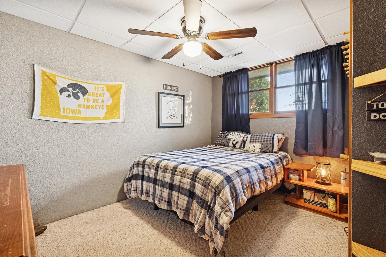 5430 Holly Road Fulton, IL 61252 - Photo 24 of 33 a bedroom with a bed and a chandelier