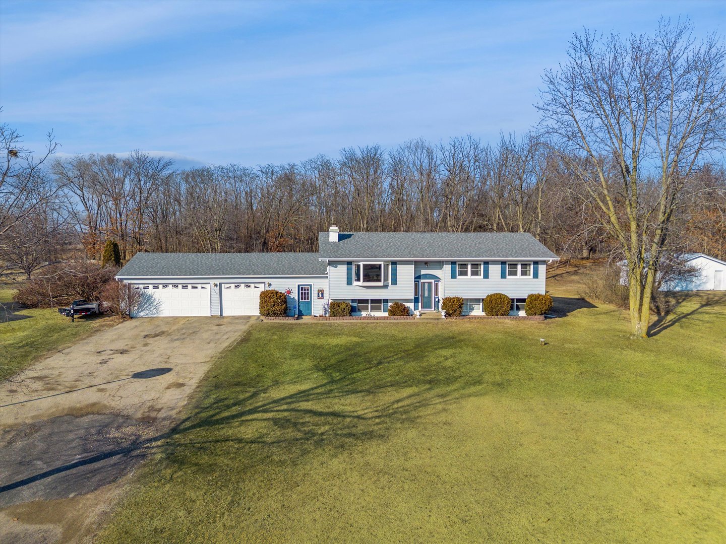 5430 Holly Road Fulton, IL 61252 - Photo 25 of 33 a front view of house with yard and trees in the background