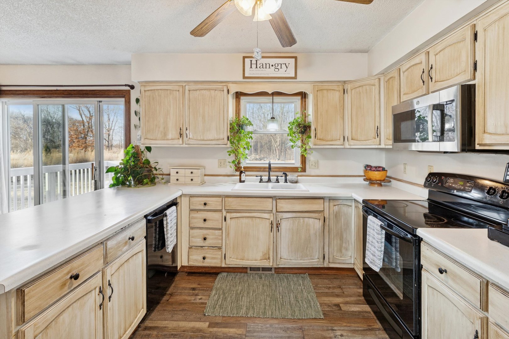 5430 Holly Road Fulton, IL 61252 - Photo 7 of 33 a kitchen with a white cabinets and window