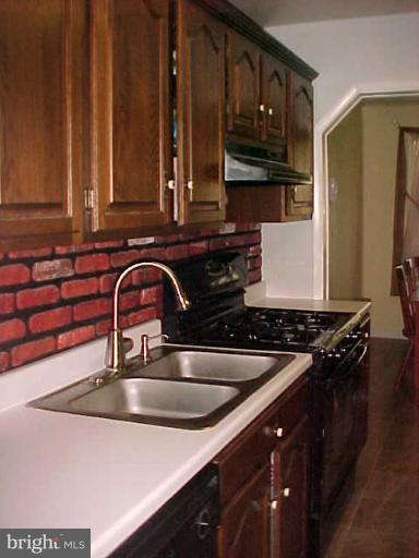 1909 Bayberry Road Edgewood, MD 21040 - Photo 2 of 28 a kitchen with stainless steel appliances a sink stove and cabinets