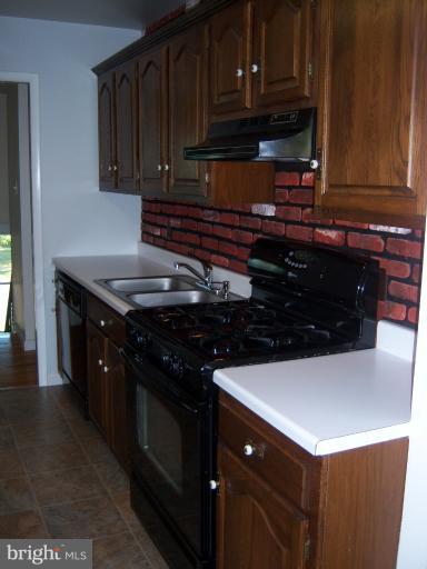1909 Bayberry Road Edgewood, MD 21040 - Photo 25 of 28 a kitchen with a sink and cabinets