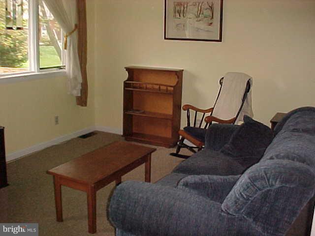 1909 Bayberry Road Edgewood, MD 21040 - Photo 4 of 28 a living room with a couch and a window