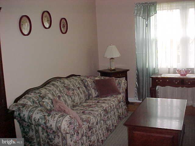 1909 Bayberry Road Edgewood, MD 21040 - Photo 5 of 28 a bed sitting in a bedroom next to a window