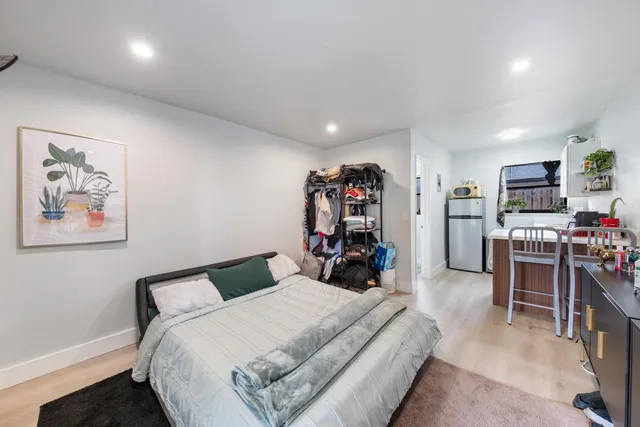 a bedroom with a bed and furniture