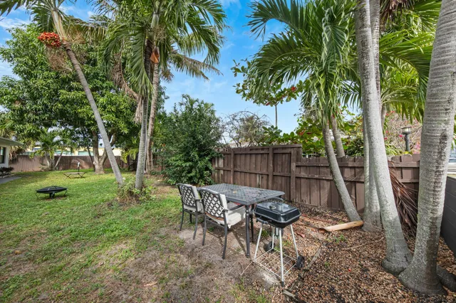 a view of a wooden deck with chairs and a table