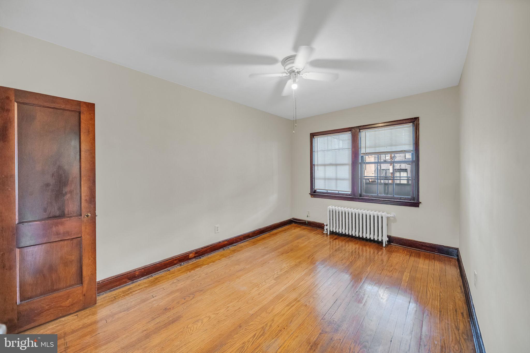 220 21st Street Northeast Washington, DC 20002 - Photo 18 of 26 wooden floor in an empty room with a window