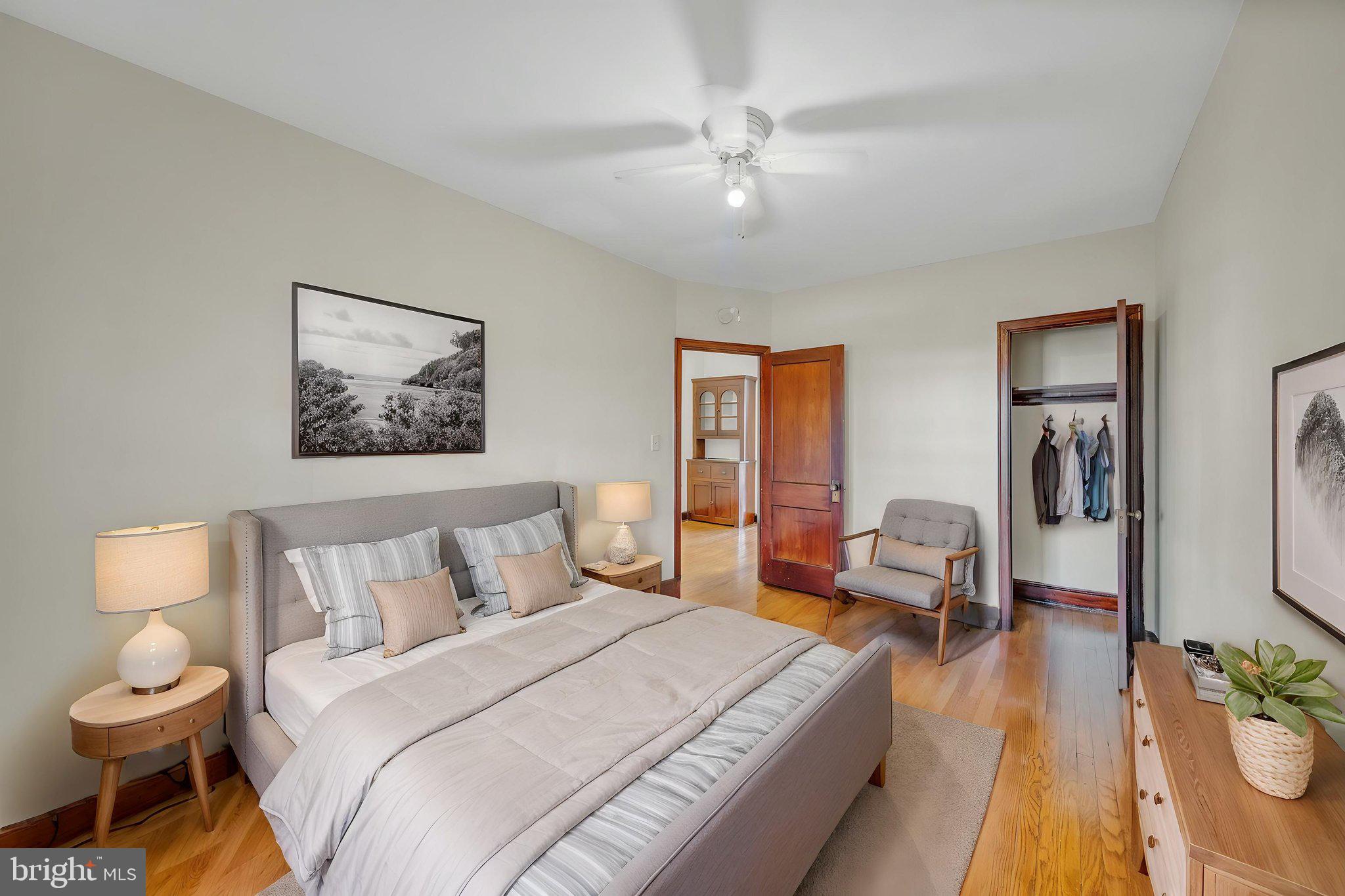 220 21st Street Northeast Washington, DC 20002 - Photo 20 of 26 a spacious bedroom with a bed and wooden floor