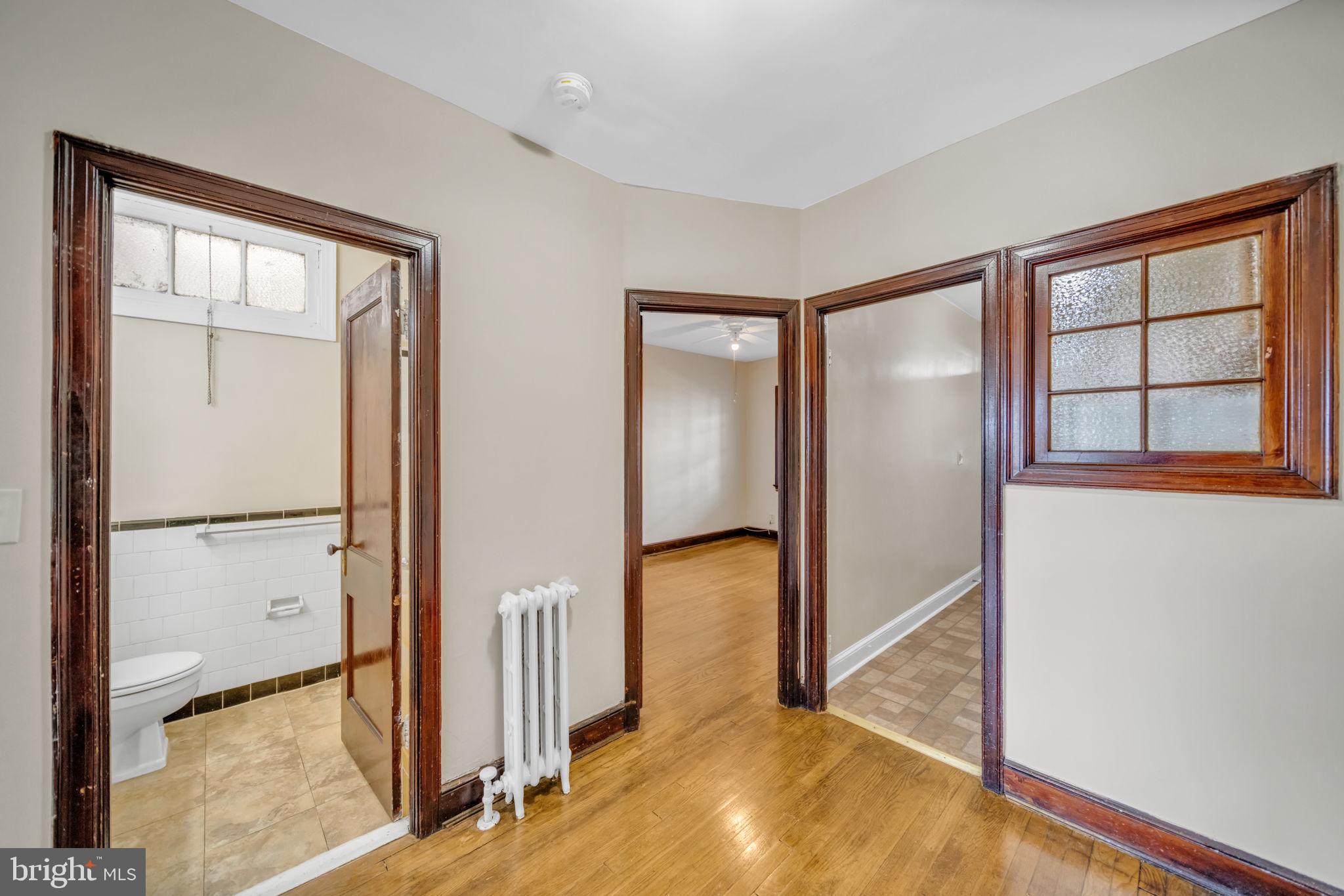 220 21st Street Northeast Washington, DC 20002 - Photo 23 of 26 a view of a livingroom with wooden floor and a hallway