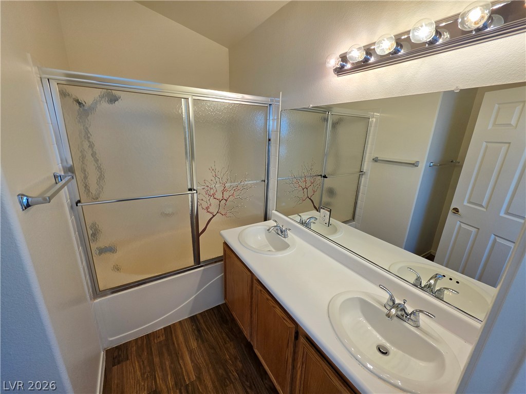 1154 Point Success Avenue Henderson, NV 89014 - Photo 17 of 26 Double vanity and bath with shower await in this well-appointed bathroom.