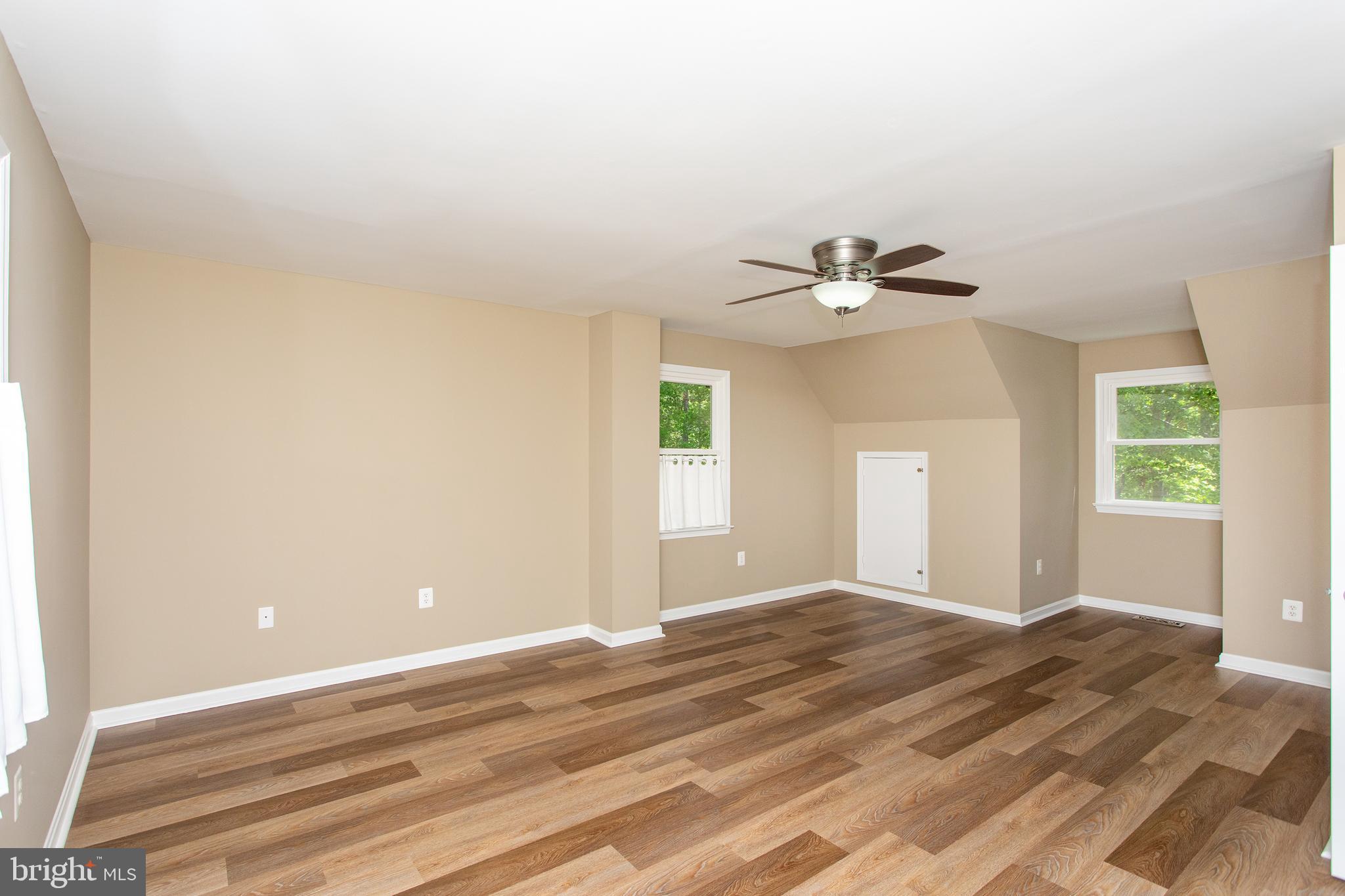 540 Thunderbird Drive Lusby, MD 20657 - Photo 16 of 66 a view of a livingroom with a ceiling fan and window