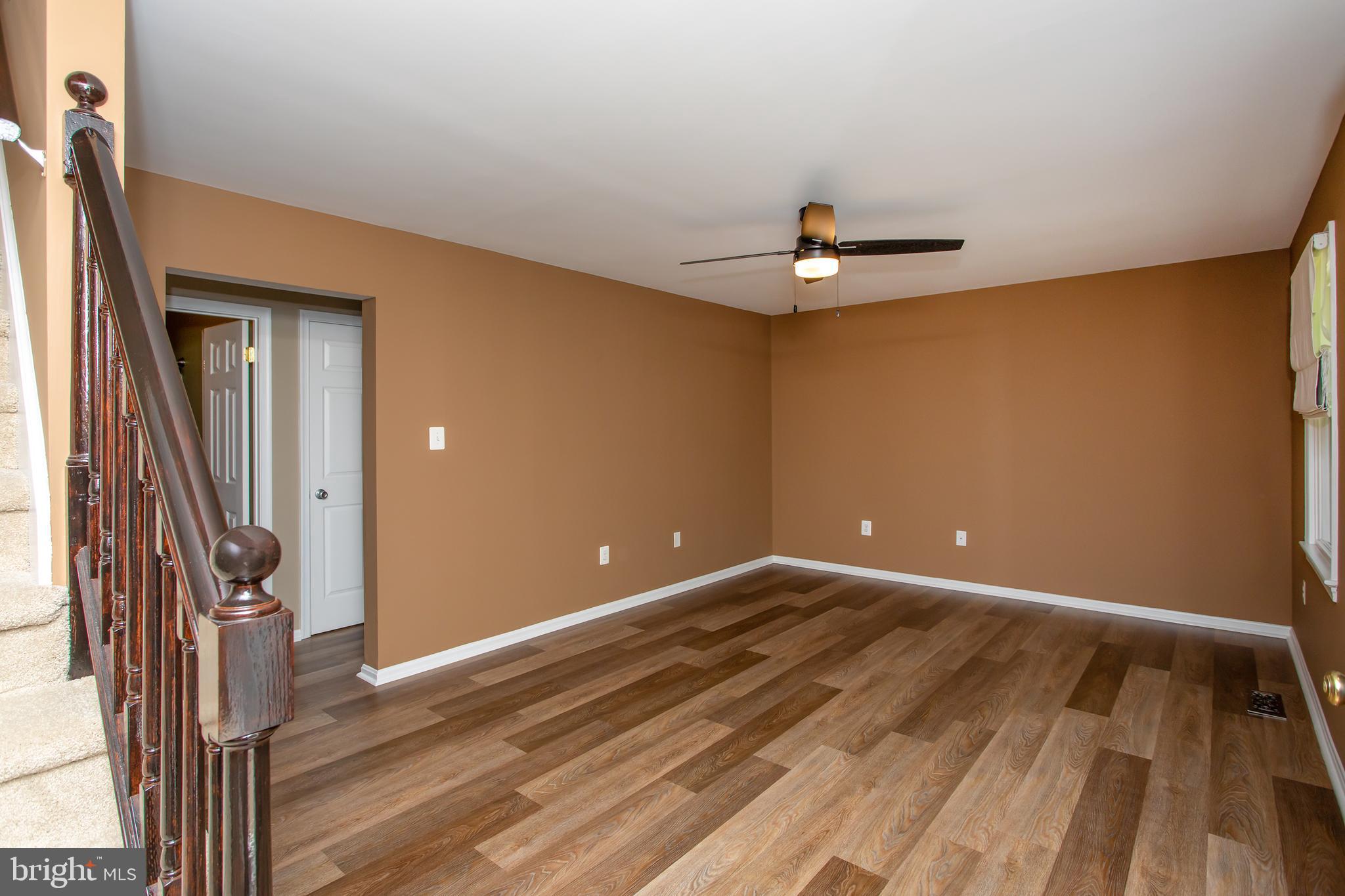 540 Thunderbird Drive Lusby, MD 20657 - Photo 21 of 66 a view of an empty room with wooden floor and a window