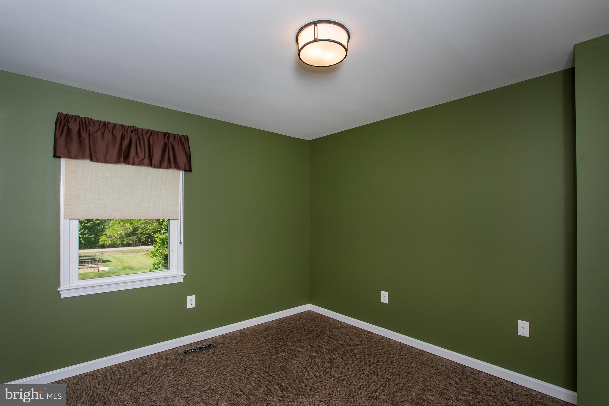 540 Thunderbird Drive Lusby, MD 20657 - Photo 27 of 66 a view of a room with a fan and a window