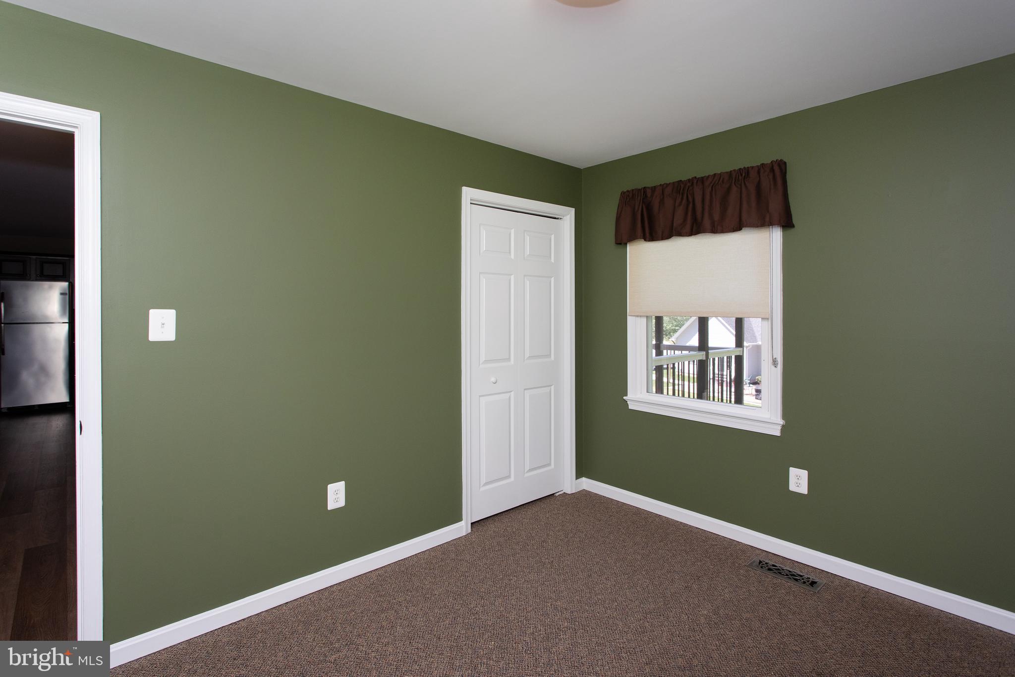 540 Thunderbird Drive Lusby, MD 20657 - Photo 28 of 66 an empty room with windows and closet