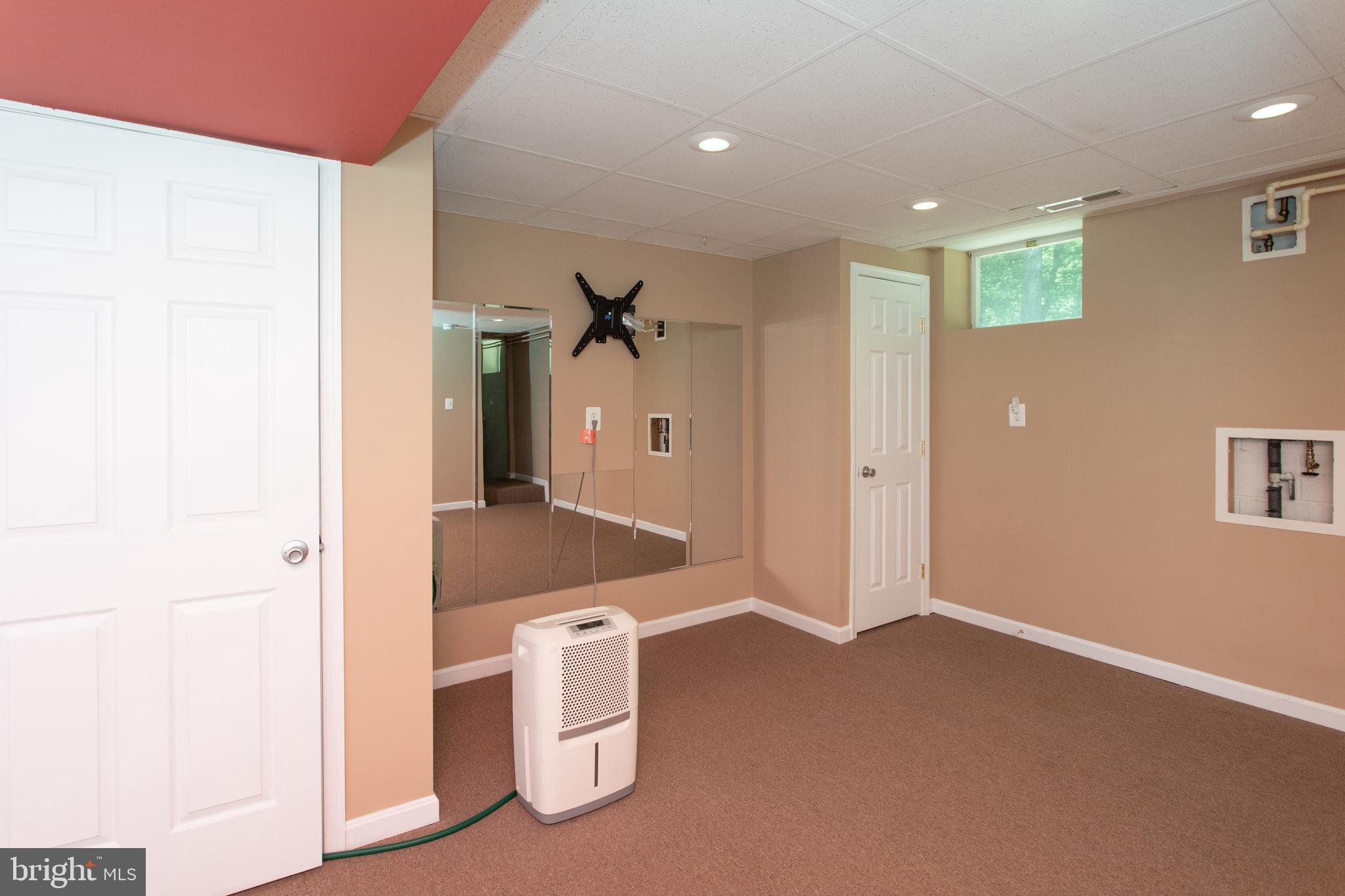 540 Thunderbird Drive Lusby, MD 20657 - Photo 45 of 66 a bathroom with a sink and mirror