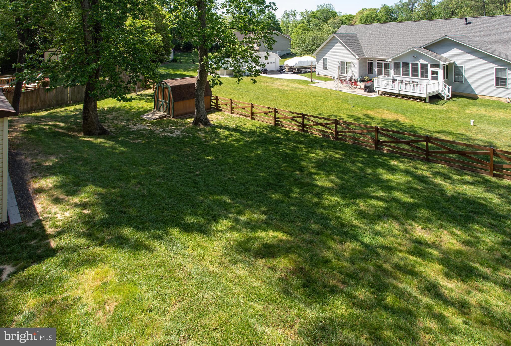 540 Thunderbird Drive Lusby, MD 20657 - Photo 52 of 66 a view of a house with a big yard and large trees