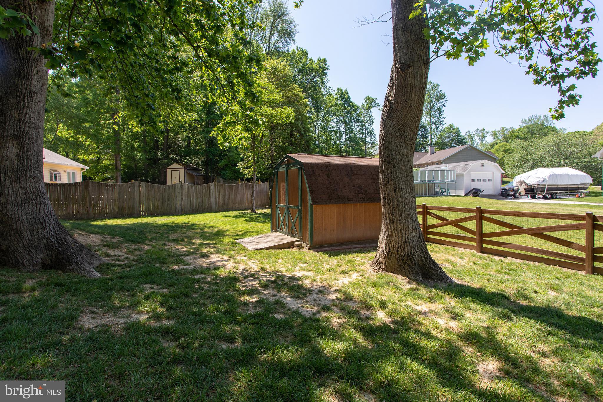 540 Thunderbird Drive Lusby, MD 20657 - Photo 56 of 66 a view of a backyard with a small cabin