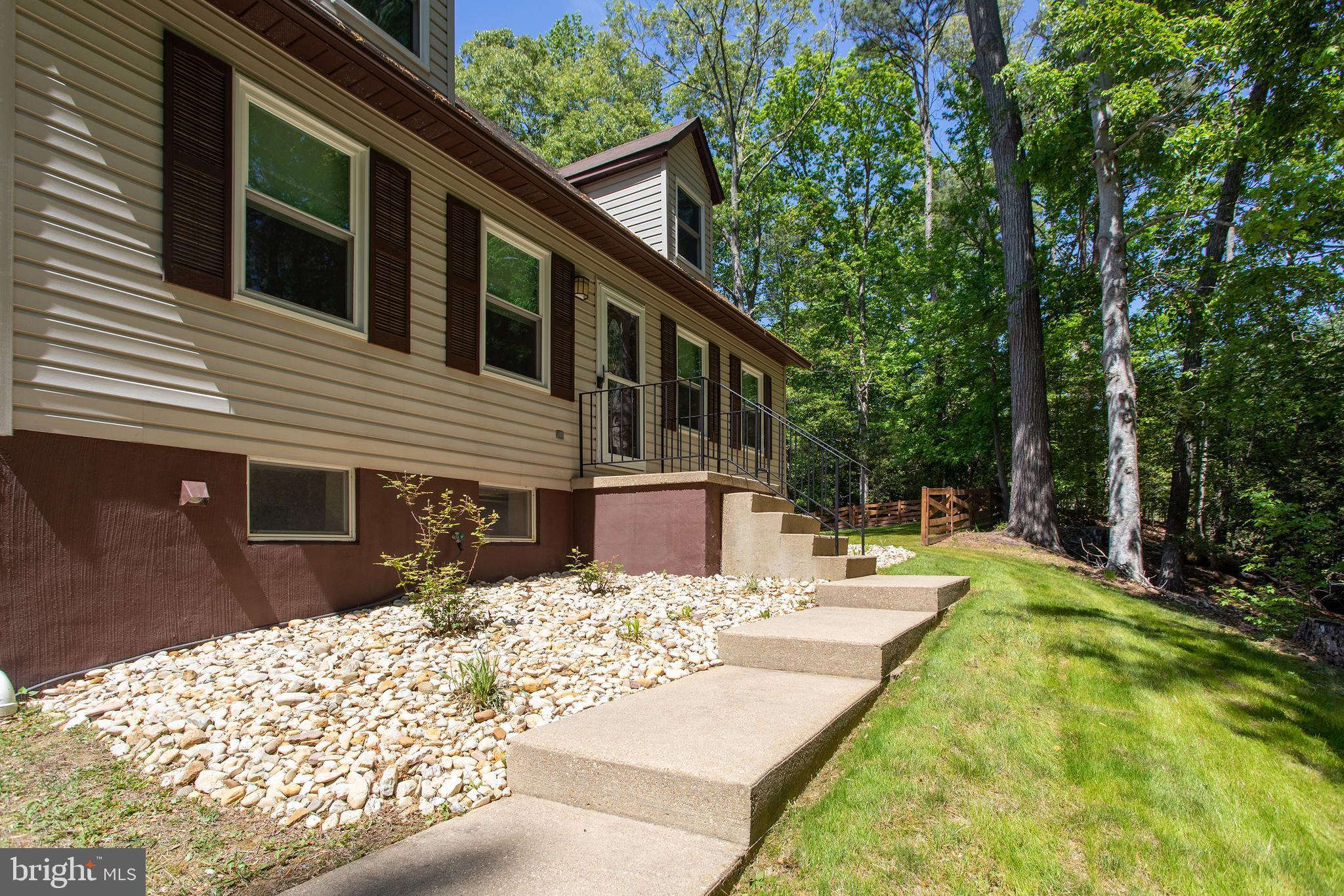 540 Thunderbird Drive Lusby, MD 20657 - Photo 6 of 66 a view of a house with backyard and sitting area