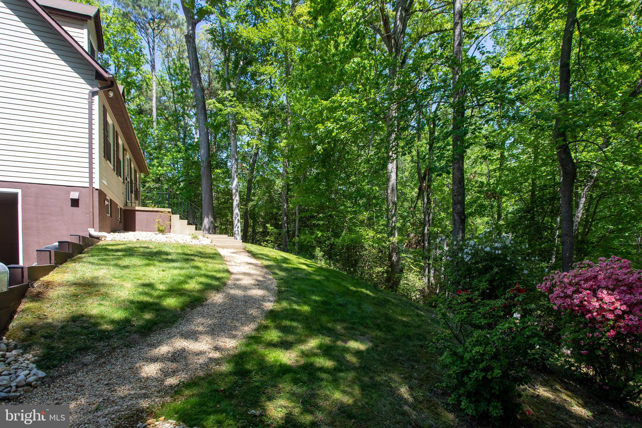 540 Thunderbird Drive Lusby, MD 20657 - Photo 62 of 66 a backyard of a house with lots of green space