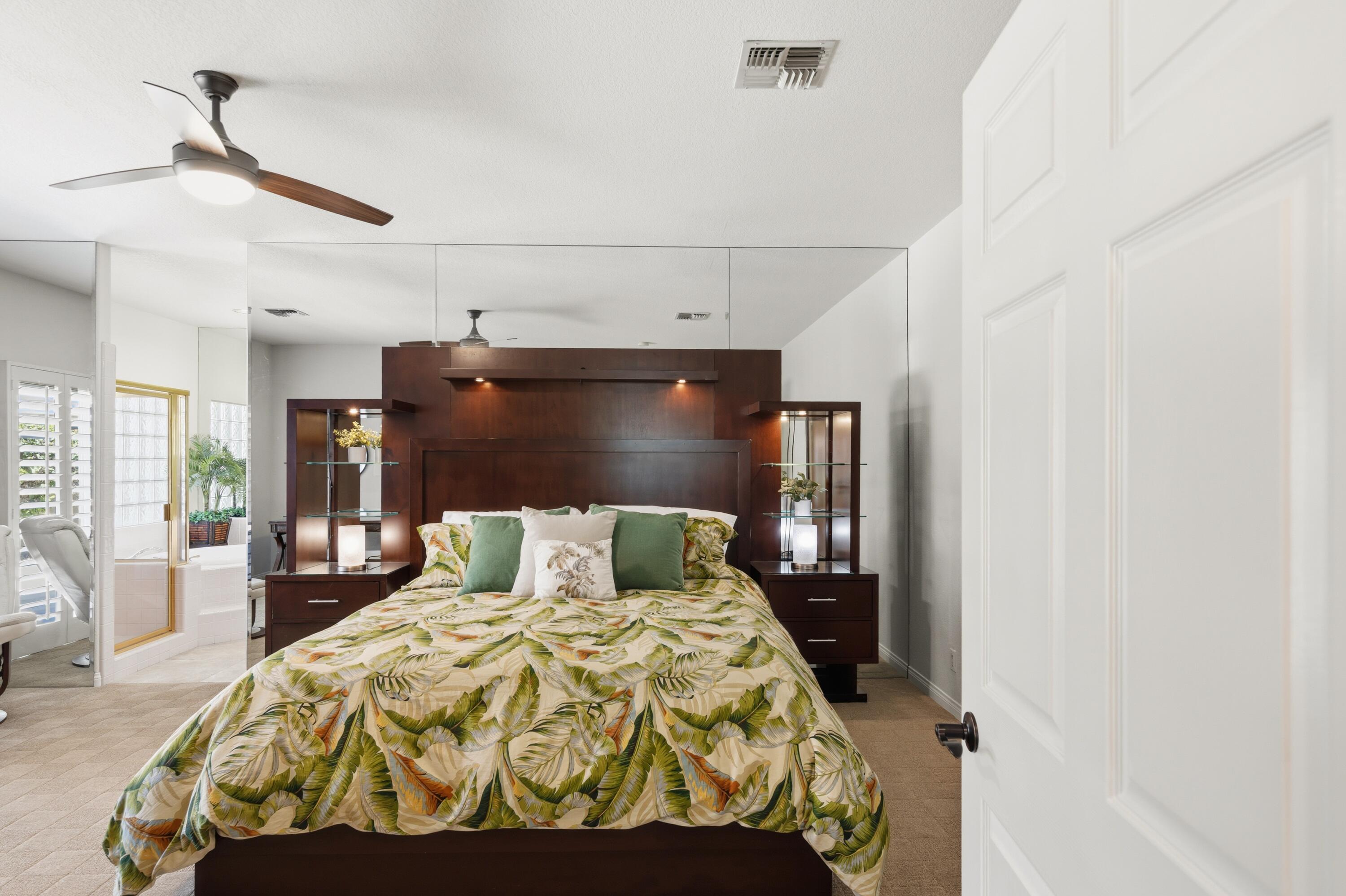 39 Augusta Drive Rancho Mirage, CA 92270 - Photo 25 of 53 a bedroom with a bed and wooden floor