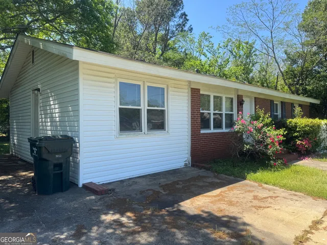 a view of house with yard