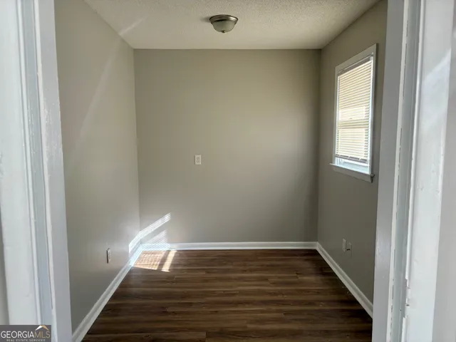 a view of a livingroom with wooden floor
