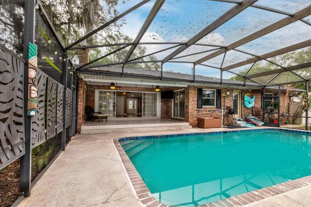 a view of a swimming pool with a patio